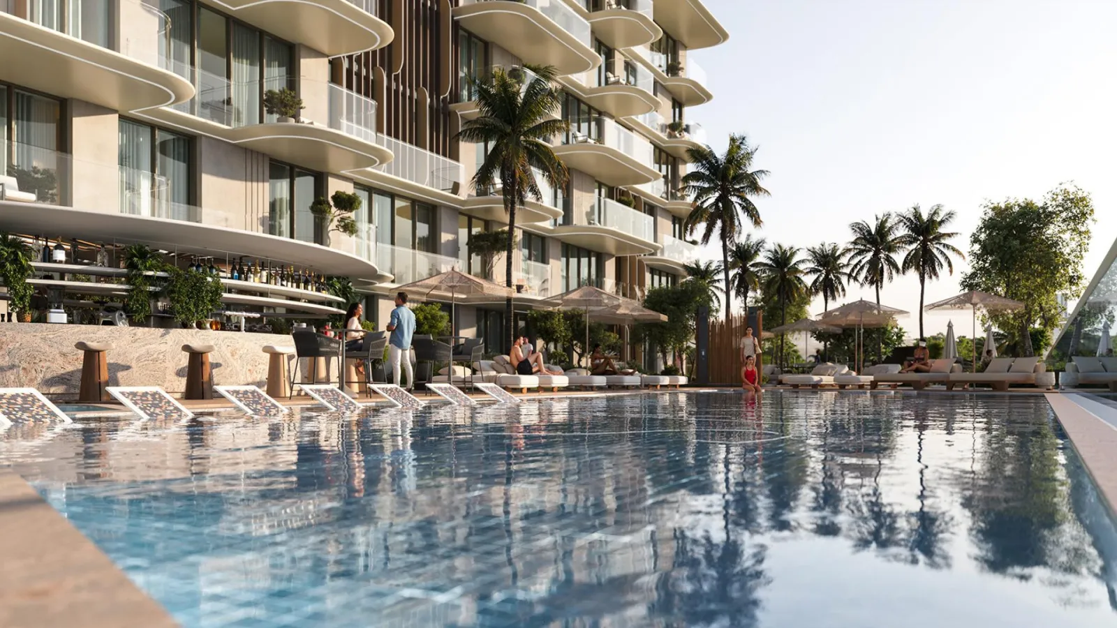 Infinity pool, sun loungers and pool bar on the amenity deck at South Haven Samana